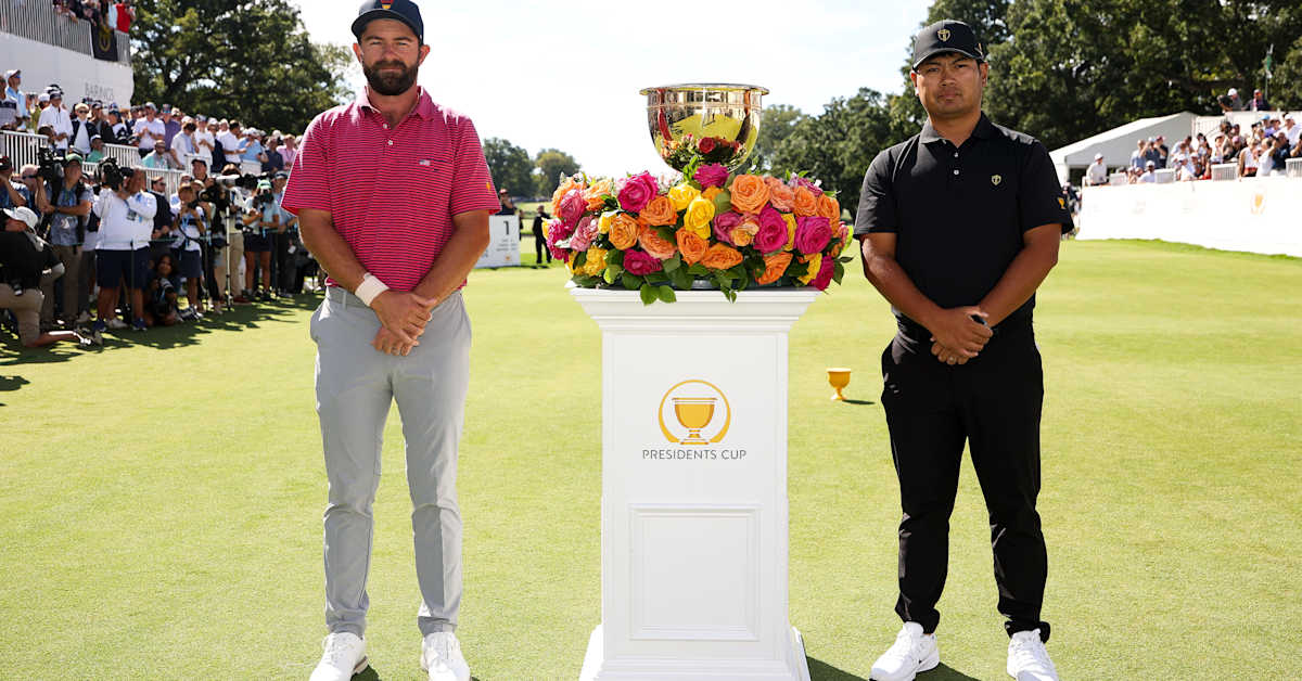 Cameron Young and Ryo Hisatsune with the Presidents Cup at Medinah